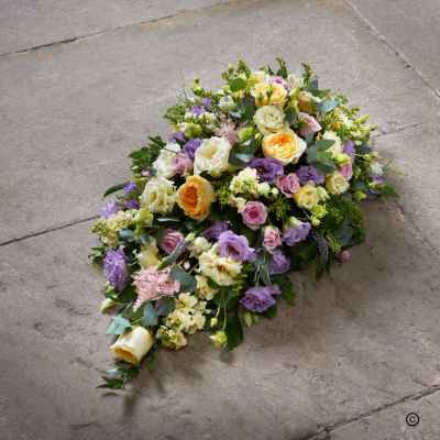Single Ended Spray - In times of loss, a traditional teardrop spray is created with a mixed selection of premium pastel colours and flowers.