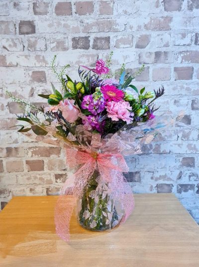 Butterfly Kisses - A pretty bouquet in vibrant pink, purple and soft peach tones, handcrafted by Daisy Chain Florist in Scunthorpe.