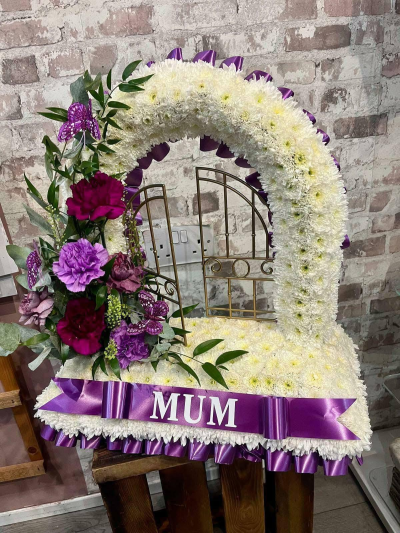 Heavenly Farewell - A beautiful Gates of Heaven funeral tribute in white and purple tones, handcrafted by Daisy Chain Florist in Scunthorpe.