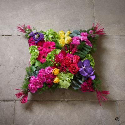 Modern Viberant Cushion - A beautiful celebration of a bright and beautiful life.  Our modern, vibrant cushion tribute breaks away from tradition, replacing muted tones with a rich explosion of bold, colorf