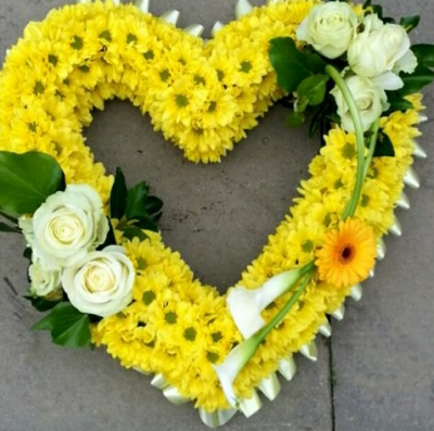 Open Heart Funeral Tribute - Handcrafted by Daisy Chain with care and skill, this open heart funeral tribute is a timeless symbol of everlasting love, affection, and remembrance. With an open center, it offers