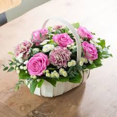 Grateful heart basket of Flowers - This classic basket overflows with a pretty pink theme, with roses as the star.  Each arrangement is handcrafted by one of our talented florists at Daisy Chain. Because they are se