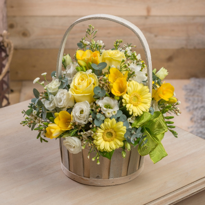 Ray of sunshine basket of yellow flowers - This classic basket overflows with a pretty pink theme, with roses as the star.  Each arrangement is handcrafted by one of our talented florists at Daisy Chain. Because they are se