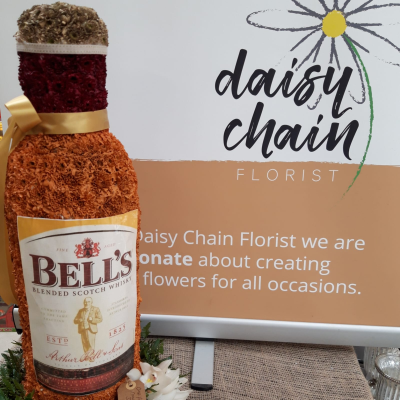 One for the road whisky bottle funeral tribute - Whisky bottle funeral tribute: a fun way to honor a friend or loved one. The whisky bottle measures 2 ft high.