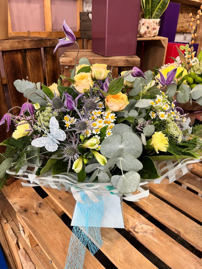 Welcome little boy handtied bouquet - The warm tones of this peach rose bouquet will capture the hearts of any family celebrating the birth of a little one. Each arrangement is handcrafted by one of our talented floris